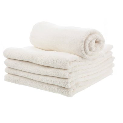 A stack of four neatly folded, large white bath towels with a blend of cotton and polyester, highlighting their durability and professional appearance.