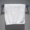Plush white hand towel for hotel and motel guests, showcasing its soft and absorbent texture.