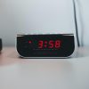 Radio alarm clock for hotel and motel guest rooms