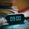 Durable radio alarm clock for hotel and motel guest rooms
