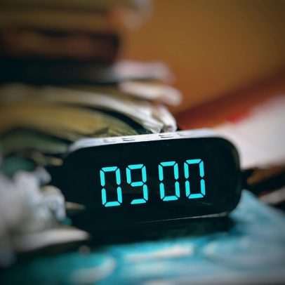 Durable radio alarm clock for hotel and motel guest rooms