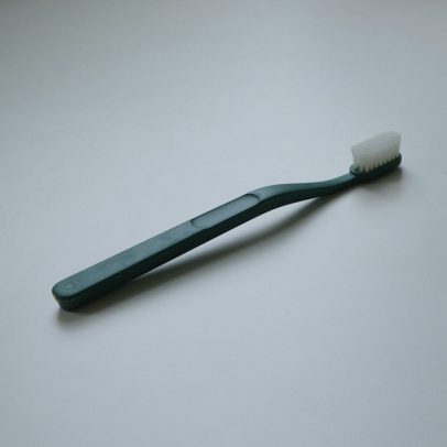 Hotel and motel guest room toothbrush