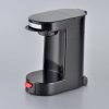 Black 1 cup coffee maker with auto shutoff for hotel guest rooms.