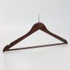 Angled view of mahogany men’s wooden hotel hanger with ball top