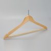 Angled view of men’s natural wood hanger with ball top and notche