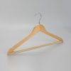 Angle view of hotel men’s hanger in natural finish with open hook