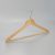 Angle view of hotel men’s hanger in natural finish with open hook