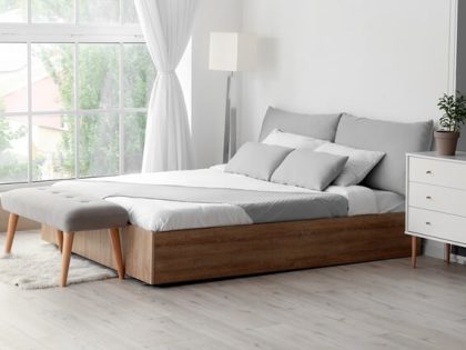 Standardized hotel room with fresh linens and amenities