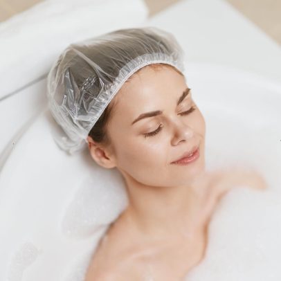 Disposable shower cap for hotel and motel bathroom amenities