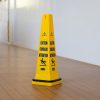 Yellow wet floor sign cone for hotels and motels