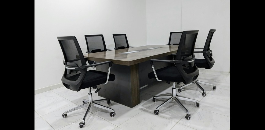 Ergonomic mesh Conference chair with adjustable armrests.