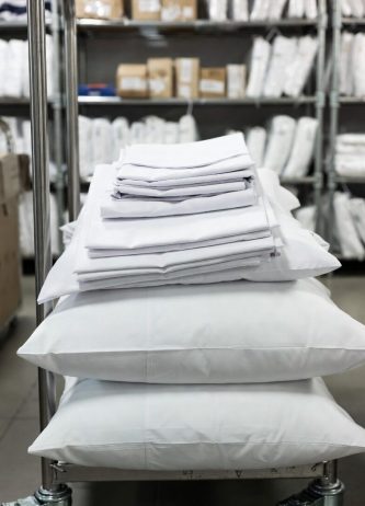 Fresh, neatly pressed Hotel Linen in a hotel supplies factory